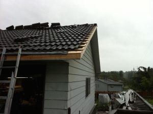 Surrey Hidden Gutter Repair - home in Surrey BC with extensive damage. This image is a cutaway reconstruction shot demonstrating the replaced hidden gutters and roof.